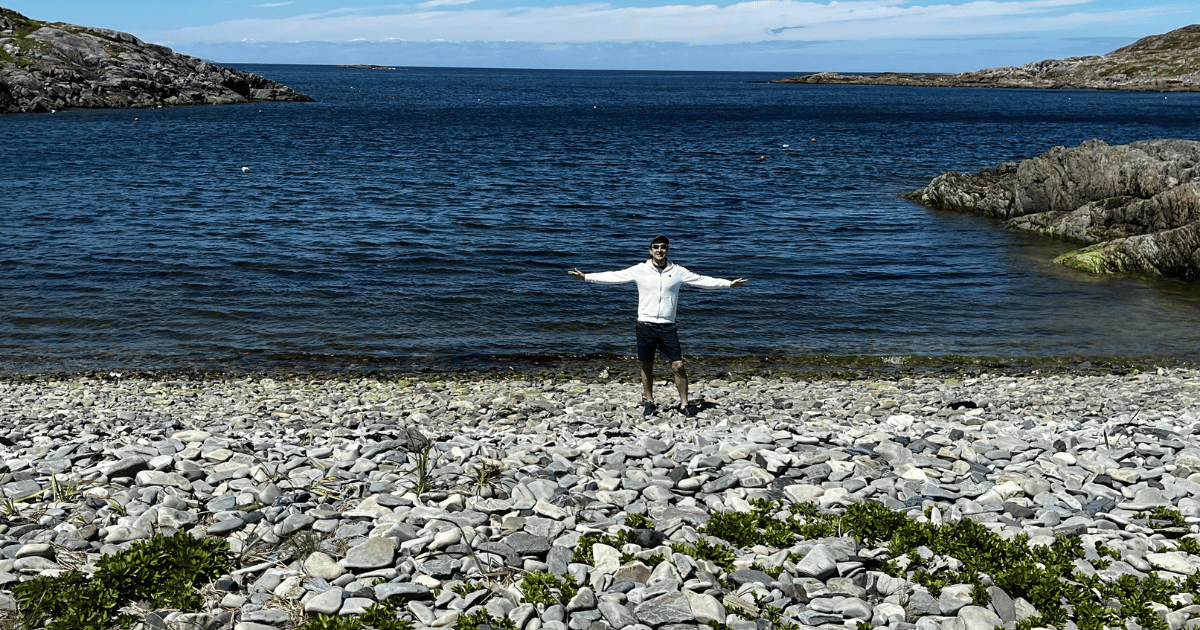 Arbo enjoying the pebble beach in Fogo Island Newfoundland 